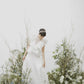 Impressive made-to-order wedding dress with flying skirt and pleated ruffle detail on top - D1603